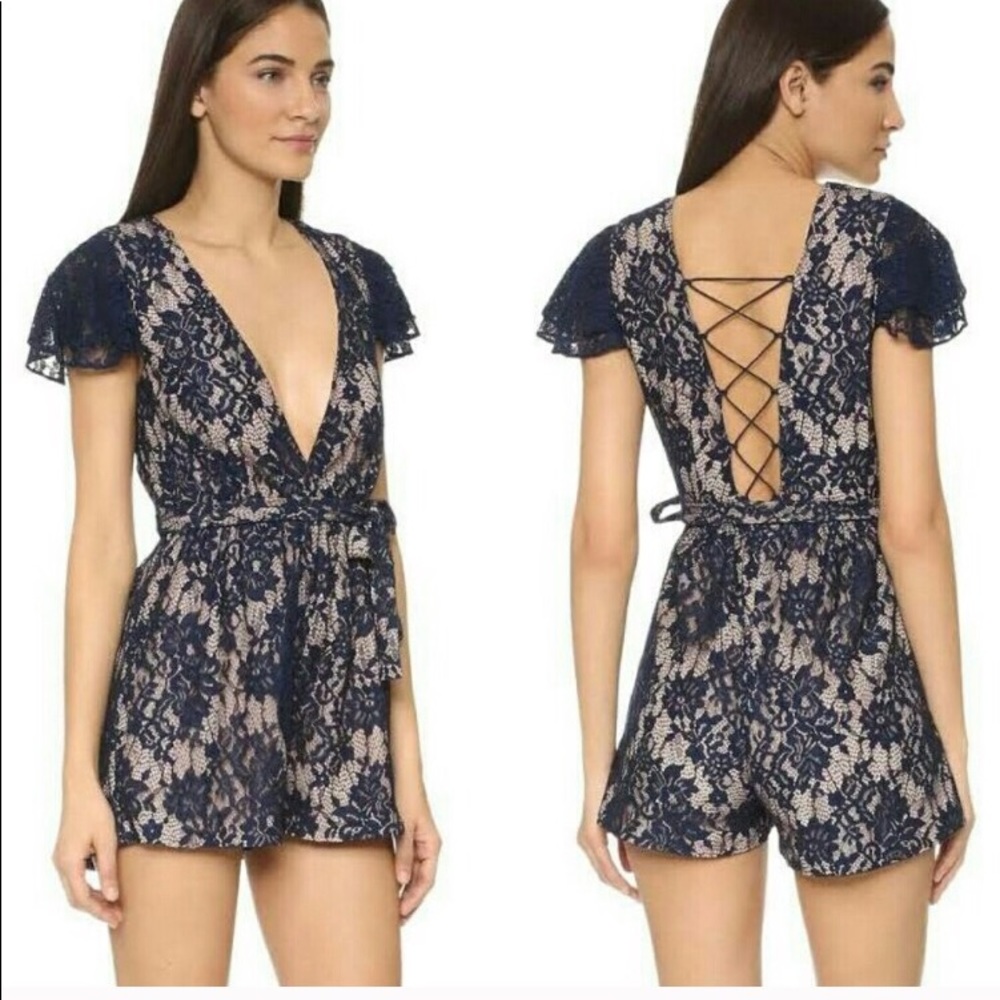 Low cut lace romper with lace up back